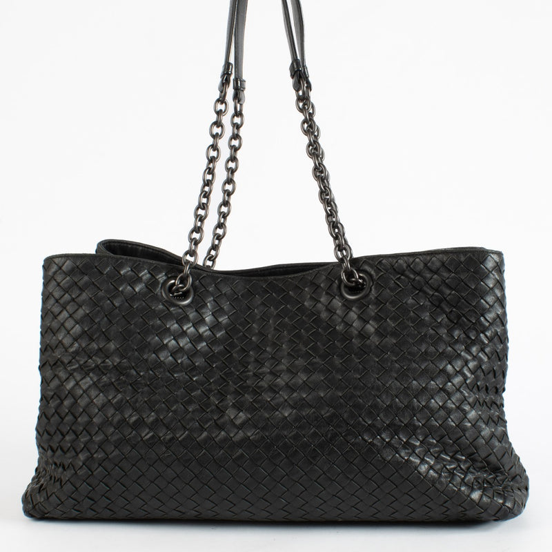 Black Bottega Veneta Intrecciato leather chain tote bag with woven design and spacious interior.