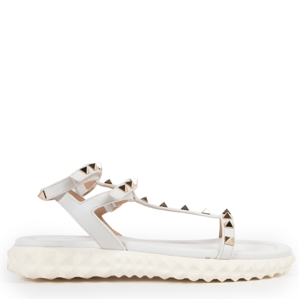 Wear these Valentino White Free Rockstud Gladiator Sandals - Size 37 during summer, so get them now at Labellov online or in store.