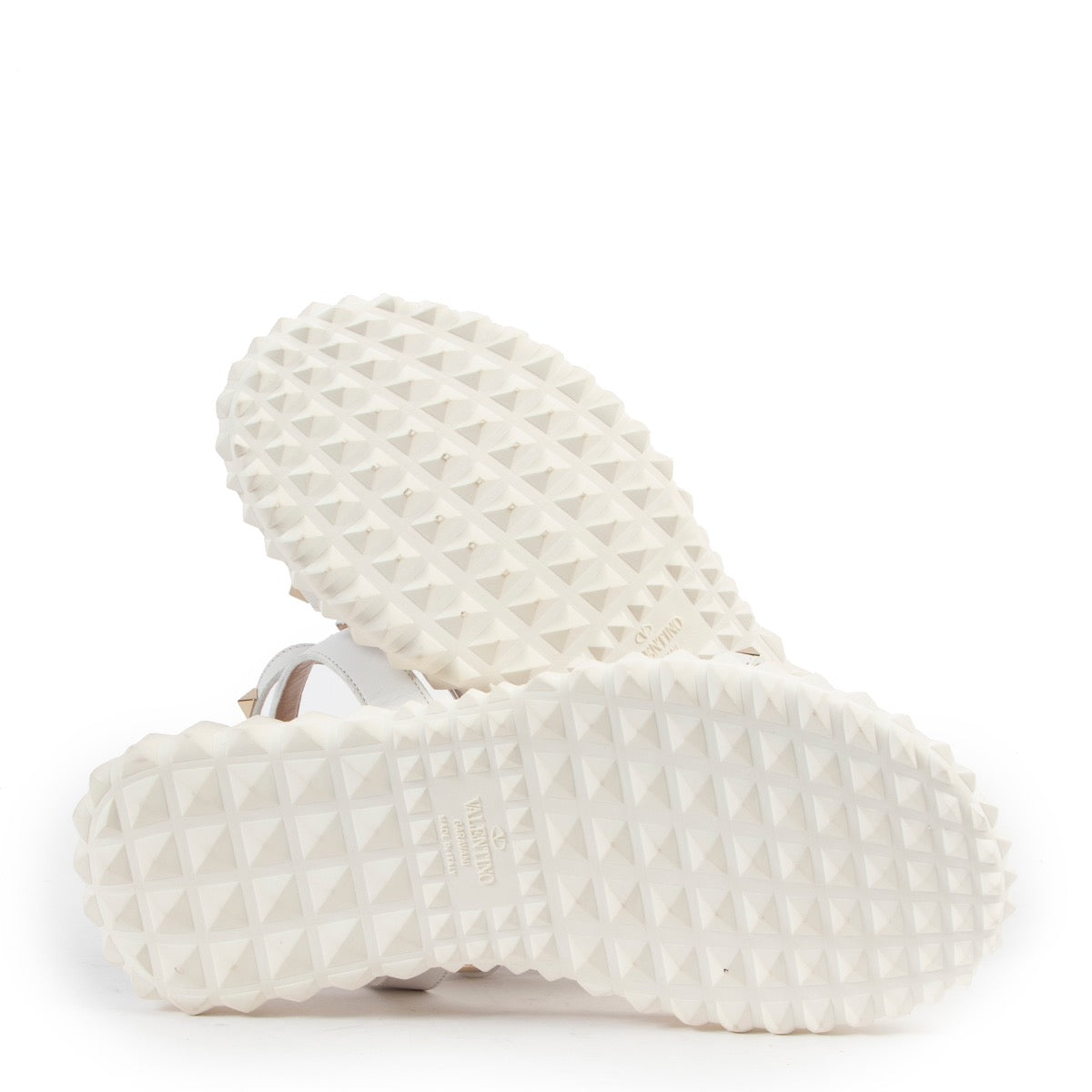 Wear these Valentino White Free Rockstud Gladiator Sandals - Size 37 during summer, so get them now at Labellov online or in store.