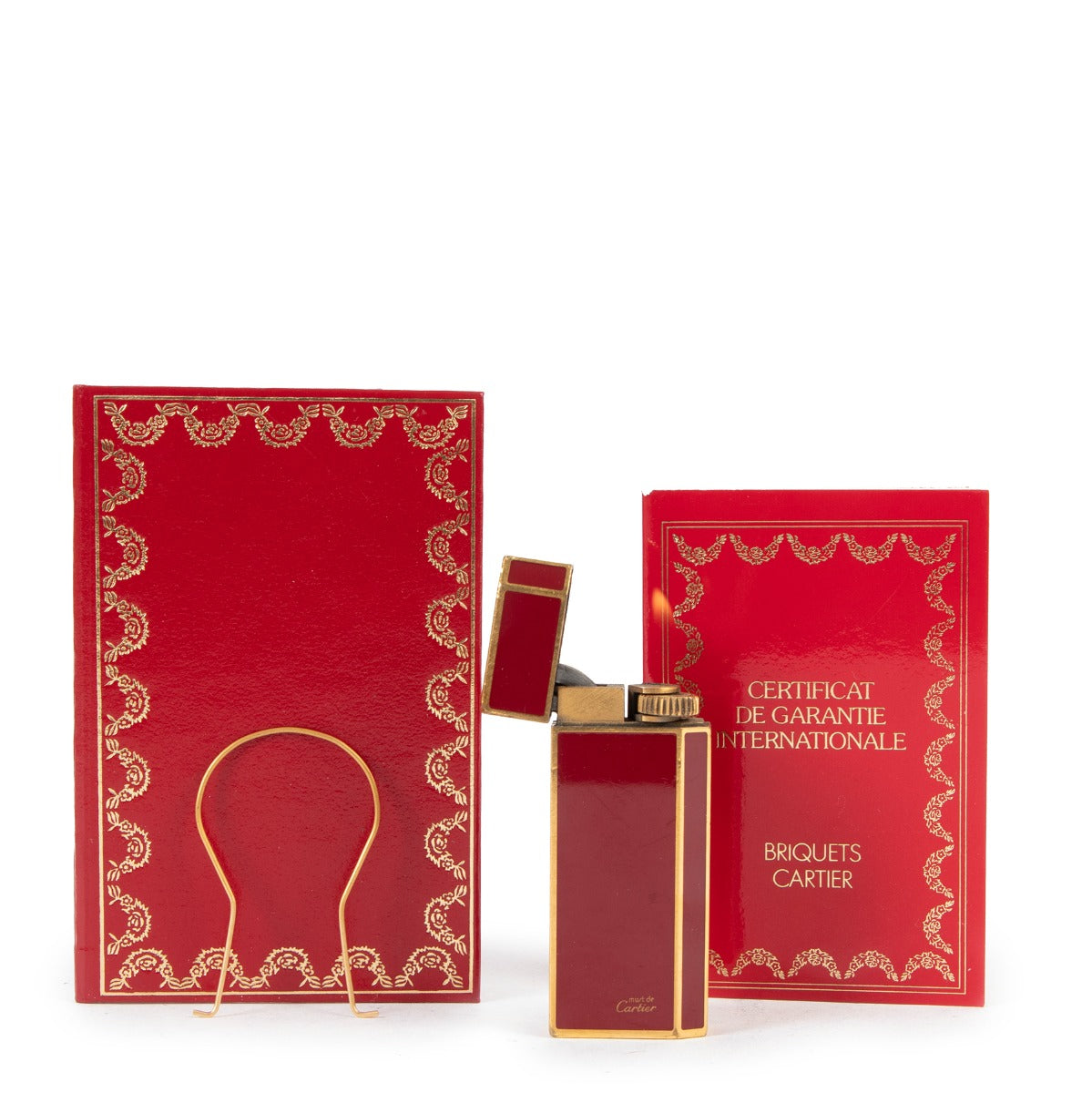 Buy online an authentic second hand Cartier Red Lacquer Gold-Plated Vintage Lighter in good condition at Labellov in Antwerp.