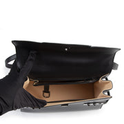 We buy and sell your authentic designer Delvaux All Black Tempête MM + Strap for the best price at Labellov secondhand vintage luxury