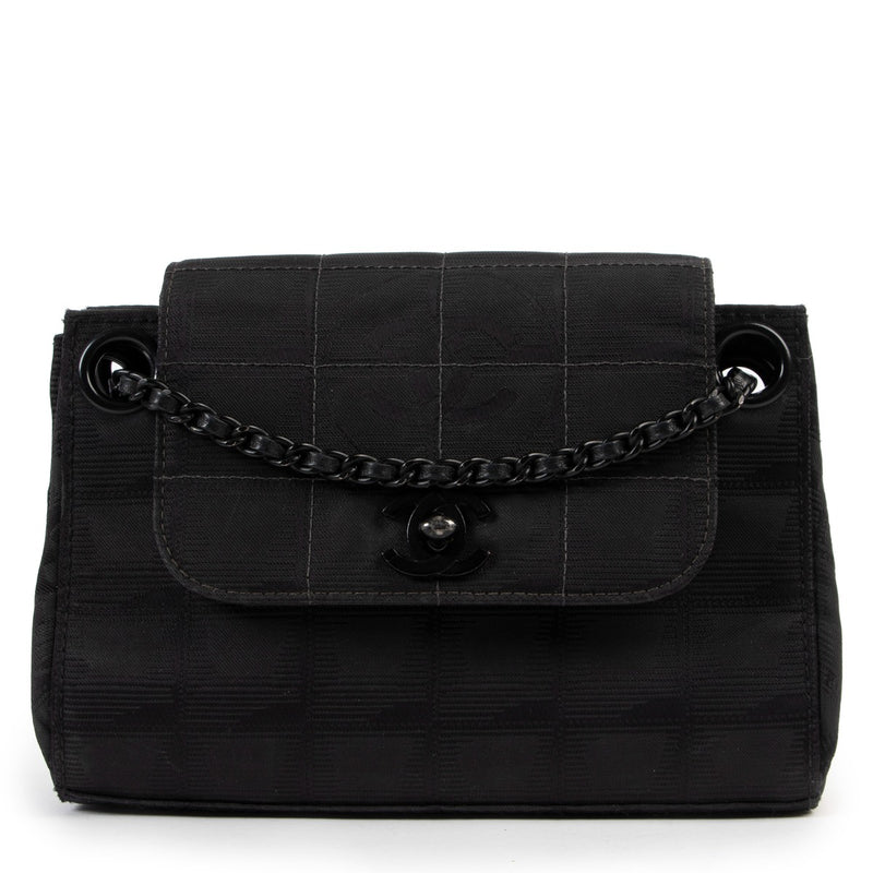 Shop authentic luxury designer vintage Chanel Black CC Travel Line Vintage Nylon Mini Shoulder Bag at Labellov for the best price.
