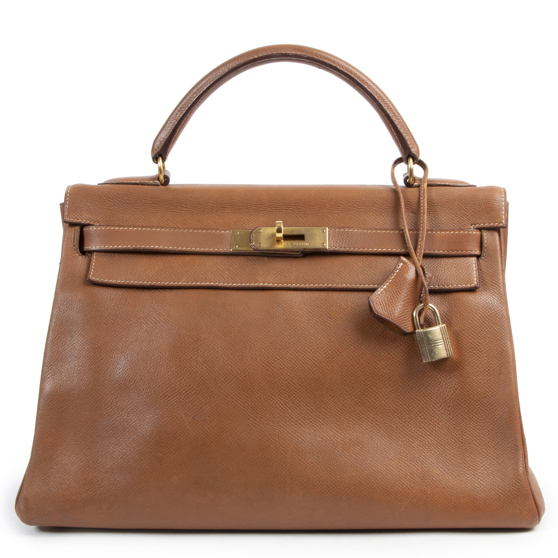 Buy this authentic second-hand vintage Hermès Kelly 32 Epsom Cognac at online webshop LabelLOV. Safe and secure shopping. Koop deze authentieke tweedehands vintage Hermès Kelly 32 Epsom Cognac bij online webshop LabelLOV.