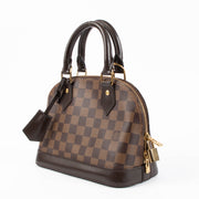 Shop the authentic Louis Vuitton Damier Ebene Alma BB Bag second hand on Labellov.com