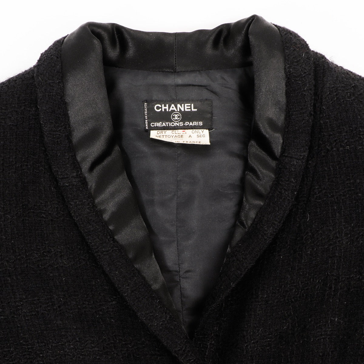 Buy an authentic second hand Chanel Créations-Paris 1971 Black Wool Tweed Jacket - Size 8 in very good condition at Labellov.com