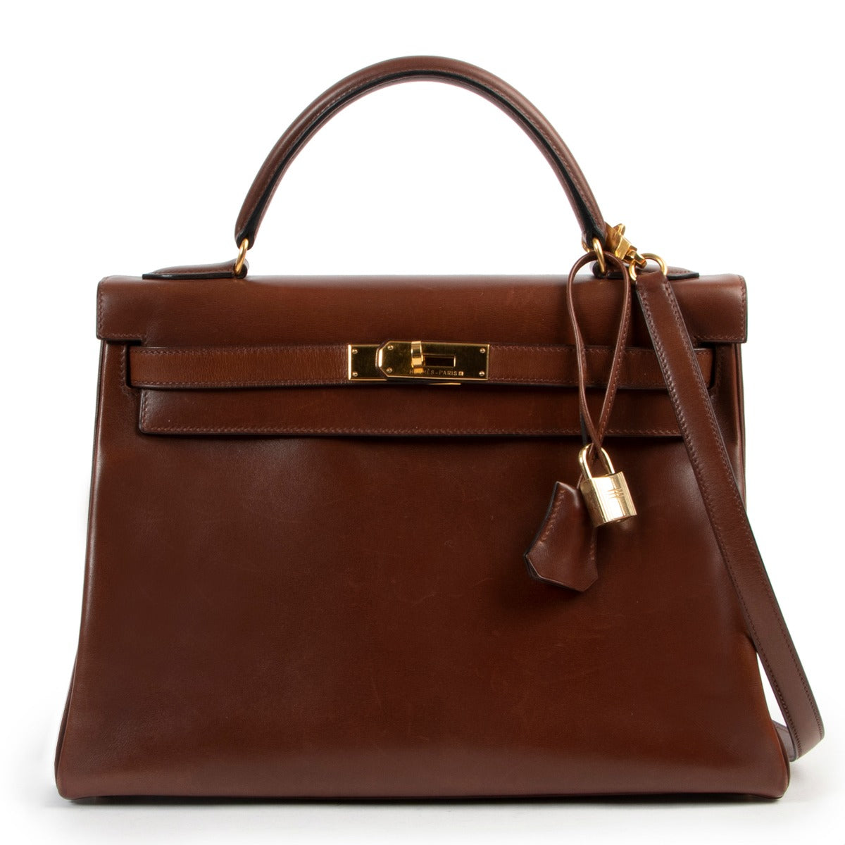 Hermès Kelly 32 Noisette Brown Boxcalf GHW at Labellov online or in store available for a reasonable price and in good condition. Get them now!