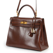 Hermès Kelly 32 Noisette Brown Boxcalf GHW at Labellov online or in store available for a reasonable price and in good condition. Get them now!