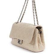 We buy and sell your authentic designer Chanel Cream Distressed Leather Flap Bag