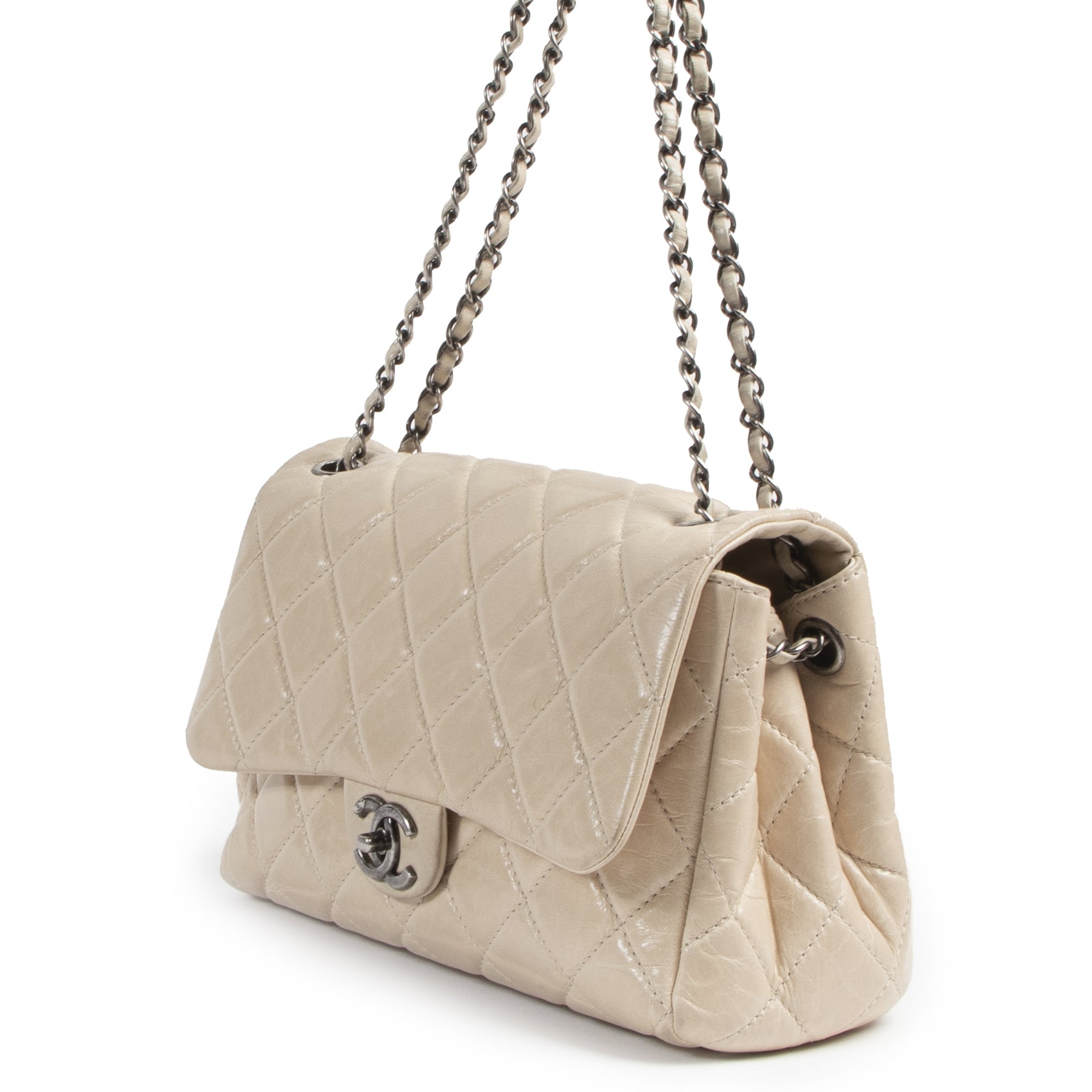 We buy and sell your authentic designer Chanel Cream Distressed Leather Flap Bag
