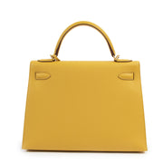 Hermès Kelly 32 Jaune Ambre Veau Epsom GHW pour le meilleur prix chez Labellov secondhand designer bags
