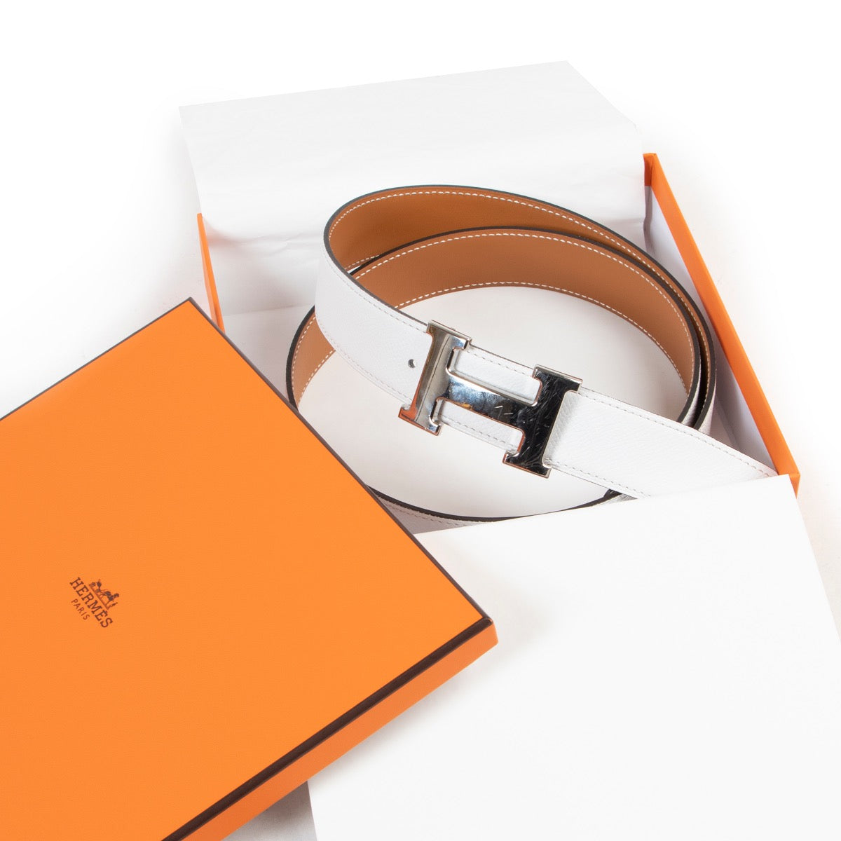 Buy online Hermès White Reversible Constance Belt in a safe way. Shop Hermès White Reversible Constance Belt online safely. Buy authentic second hand Hermès White Reversible Constance Belt in a safe way.