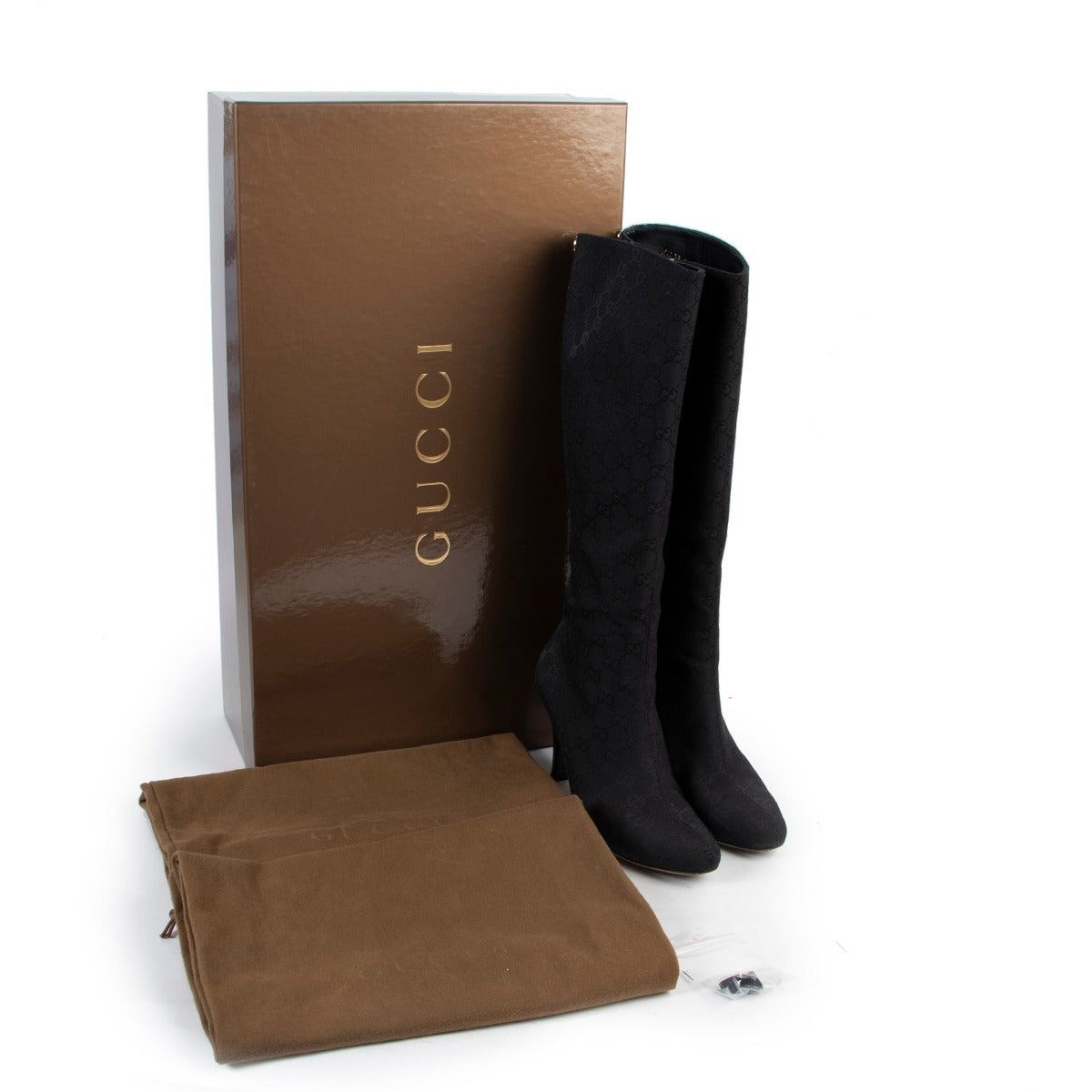 Preloved Black boots by Gucci now for sale