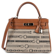 Highly exclusive and limited edition collector's piece Hermès Kelly 28 Toile de Camp Dechainee Fauve Barenia at Labellov secondhand luxury in Antwerp.