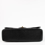 Shop the authentic Chanel Black Caviar Maxi Classic Flap Bag on Labellov.com !