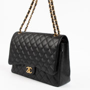 Shop the authentic Chanel Black Caviar Maxi Classic Flap Bag on Labellov.com !