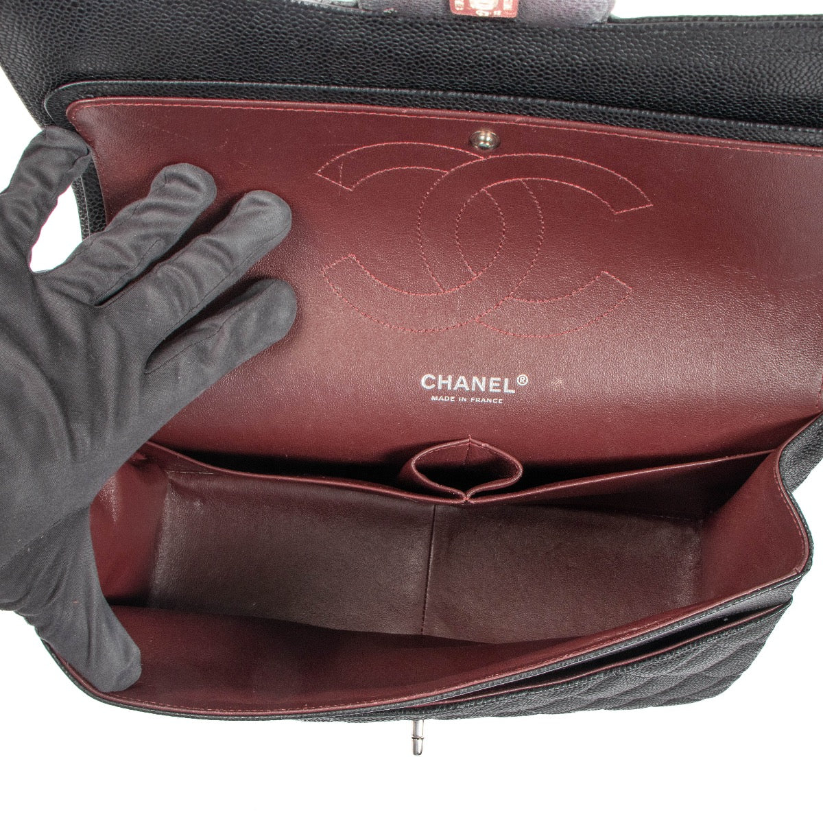 Shop 100% authentic second-hand Chanel Black Caviar Classic Flap Bag on Labellov.com