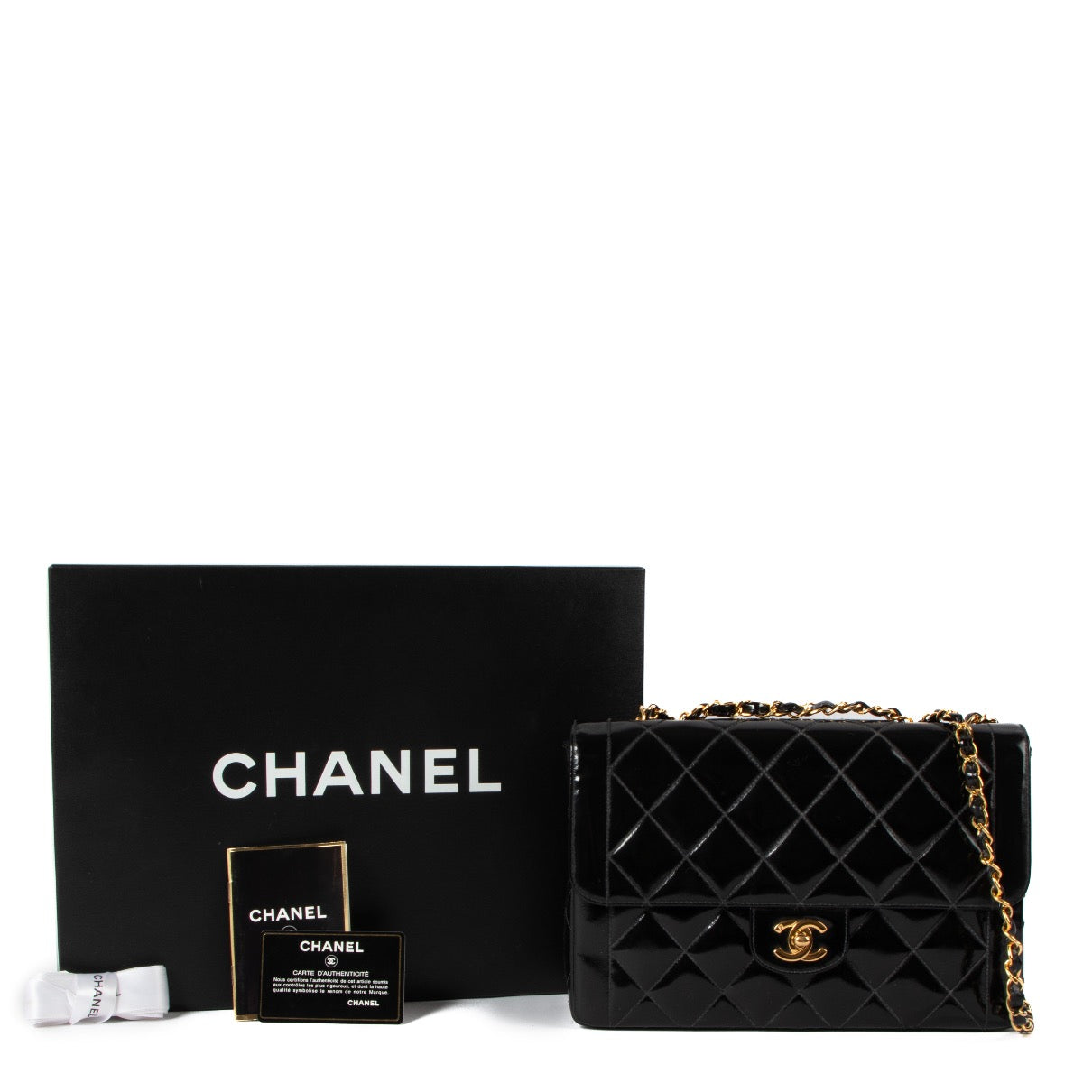 shop 100% authentic second hand Chanel Black Patent Flap Bag on Labellov.com