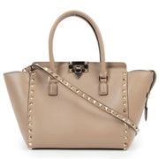 Valentino Garavani Nude Rockstud Small Leather Trapeze Bag for the best price at Labellov secondhand