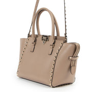 Are you intested in an authentic Valentino Garavani Nude Rockstud Small Leather Trapeze Bag?