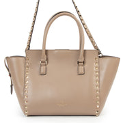 We buy and sell your authentic Valentino Garavani Nude Rockstud Small Leather Trapeze Bag for the best price