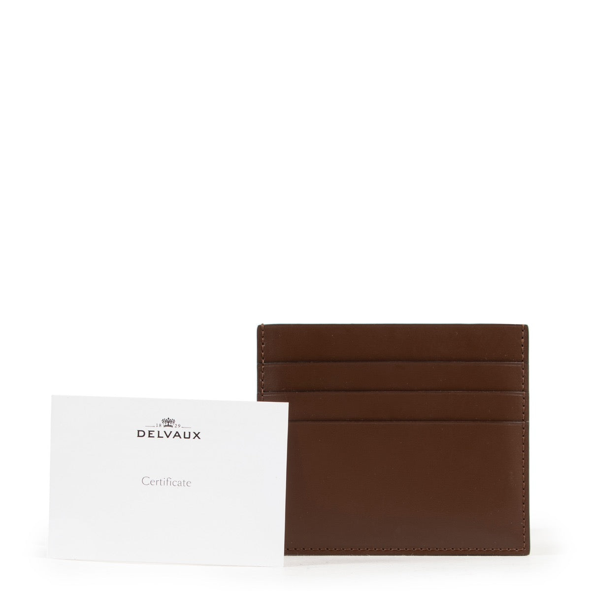Achetez en ligne en toute sécurité le porte-cartes Delvaux brune Côme PCA authentique.