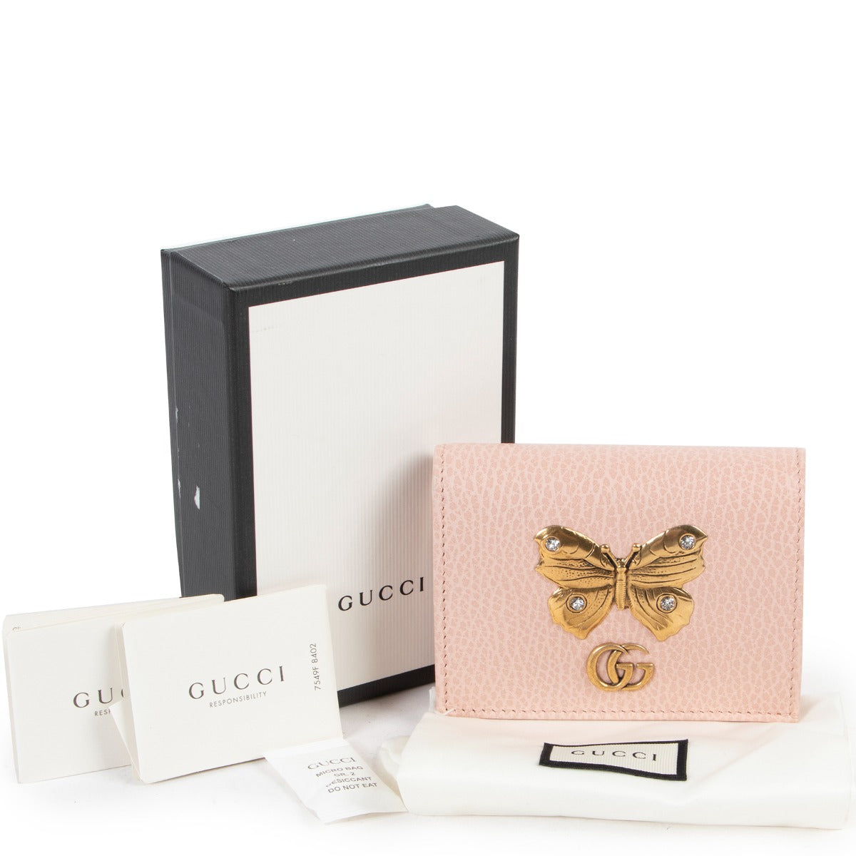 Gucci Pink Butterfly Card Case Wallet now available at Labellov Luxury for a reasonable price and in very good condition. Get this secondhand designer wallet from Gucci.