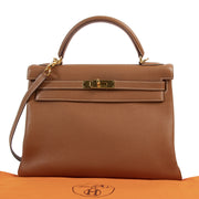 Hermès Kelly 32 Gold Togo GHW pour le meilleur prix chez Labellov à Anvers Belgique