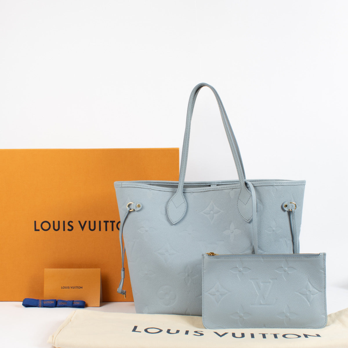 Are you looking for an authentic Louis Vuitton Neverfull Empreinte MM Blue Shoulder Bag? We buy and sell your preloved and brand new designer bags.