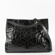 Shop this authentic luxury Saint Laurent All Black Vintage Calfksin Niki Small Shopping Bag Pre-Loved on Labellov.com
