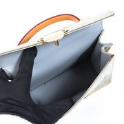 Buy an authentic second hand Louis Vuitton Champagne Vernis Spring Street Top Handle Bag in very good condition at Labellov.com