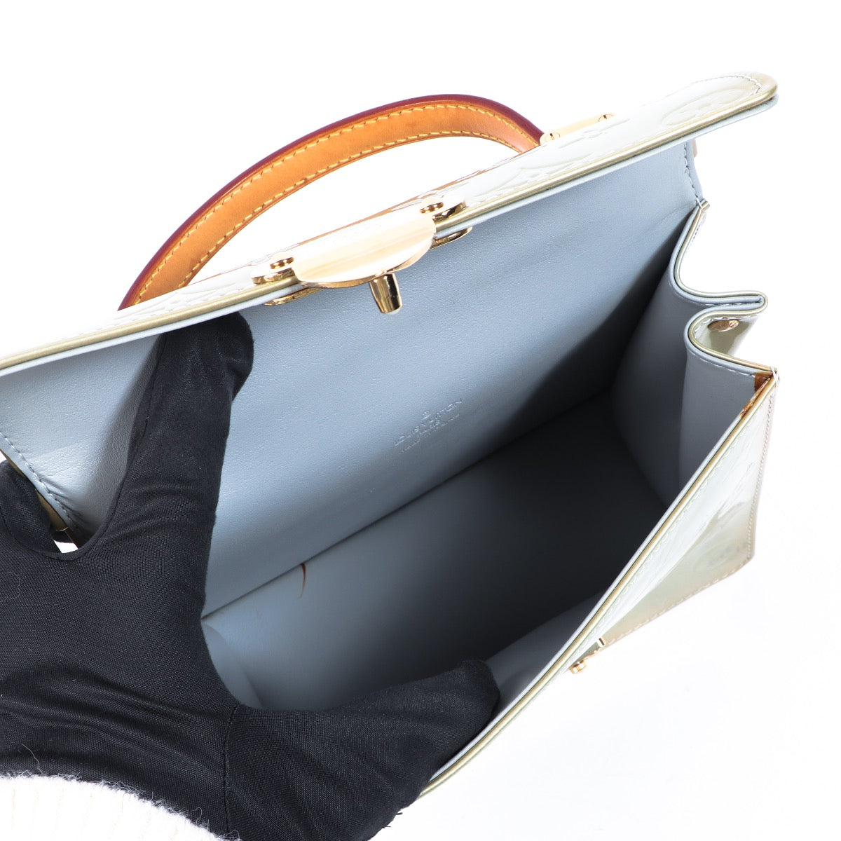Buy an authentic second hand Louis Vuitton Champagne Vernis Spring Street Top Handle Bag in very good condition at Labellov.com