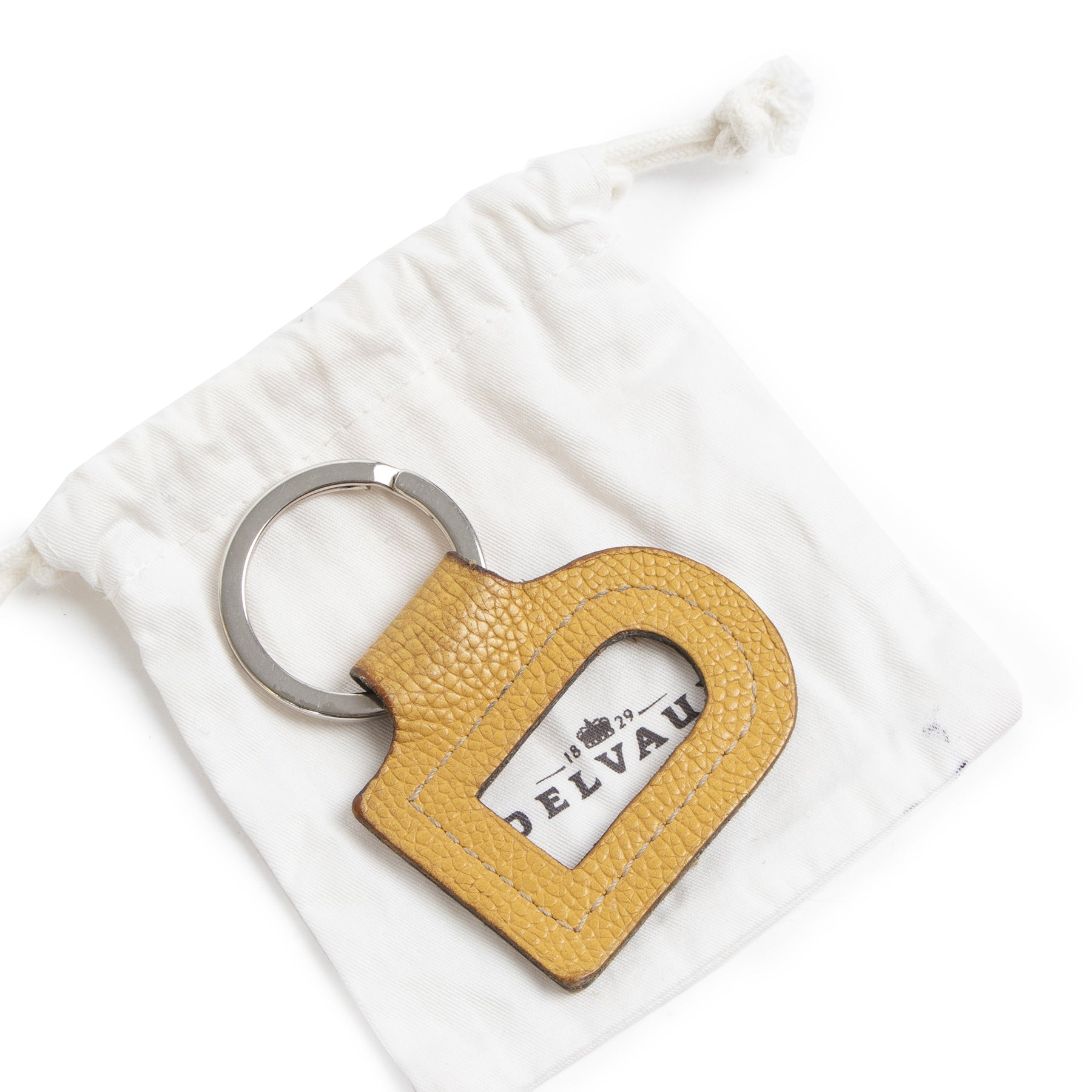 Authentieke Tweedehands Delvaux Yellow Leather D Keychain juiste prijs veilig online shoppen luxe merken webshop