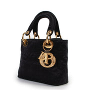 Shop safe online at Labellov in Antwerp this 100% authentic second hand Christian Dior Black Satin Mini Lady Dior in very good condition.