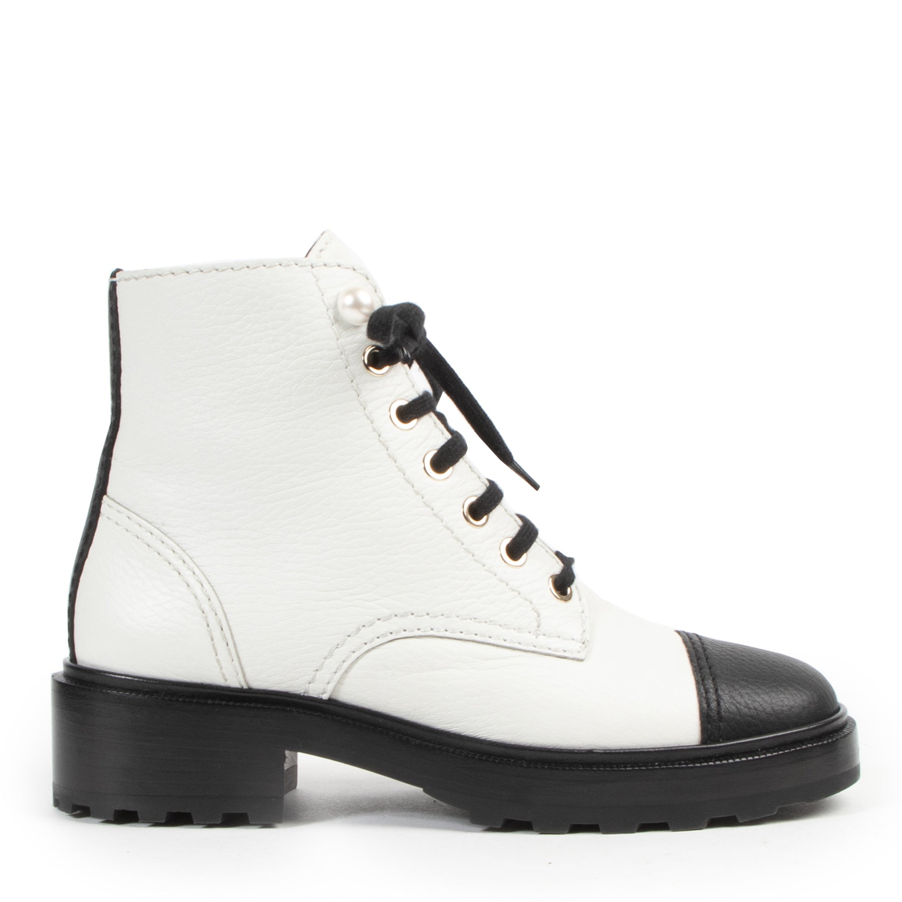 Chanel Black and White Combat Boots for the best price of 2020 at Labellov secondhand luxury goods