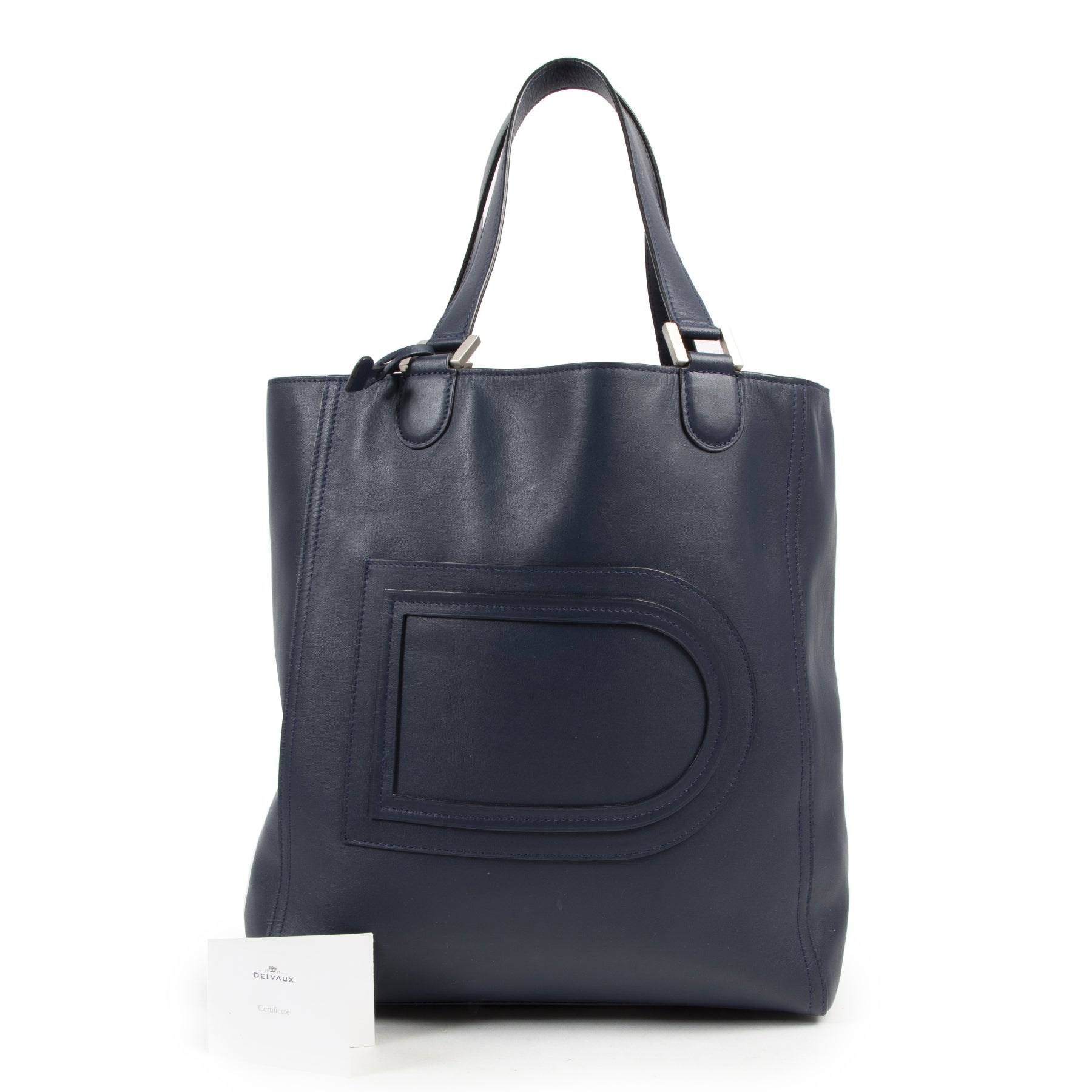 Delvaux Navy Tote Shoulder Bag. Authentieke tweedehands Delvaux handtassen bij LabelLOV Antwerpen. Authentique seconde-main luxury en ligne webshop LabelLOV. Authentic preloved Delvaux handbags at LabelLOV Antwerp.