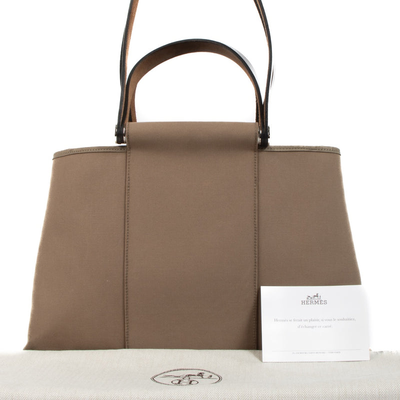 Shop safe online at Labellov in Antwerp, Brussels and Knokke this 100% authentic Hermès Grey Canvas Cabag PM 2 Way Elan Bag