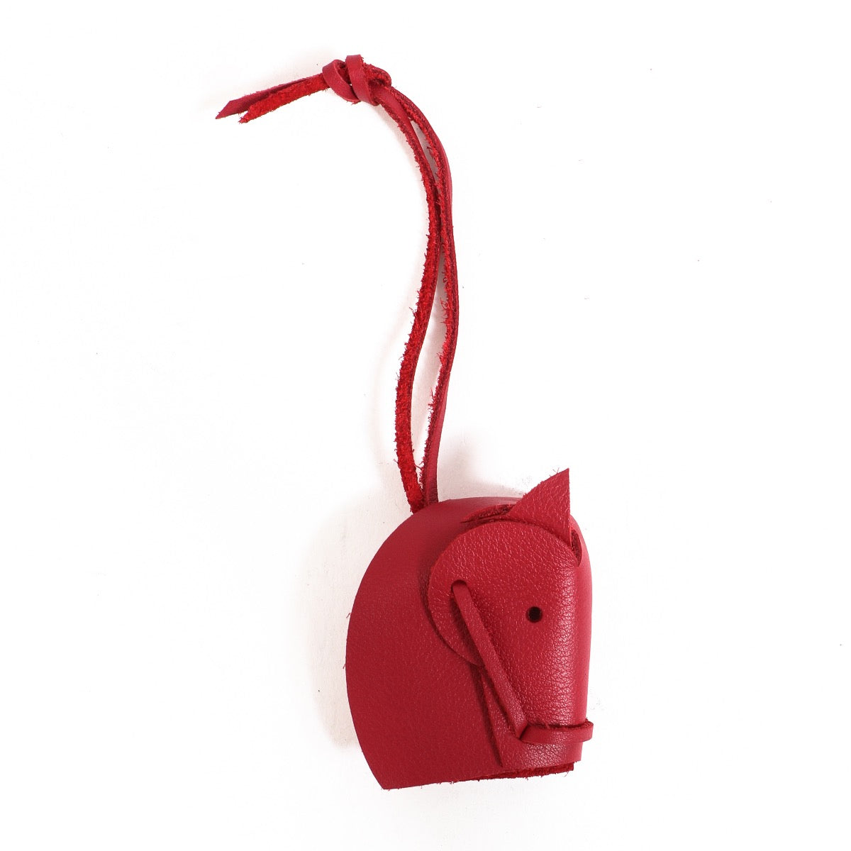 Buy an authentic Hermès Burgundy Tête De Cheval Bag Charm in as new condition at Labellov in Antwerp.