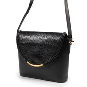 Online kopen van tweedehands authentieke Delvaux eclair handtas in zwart leer.