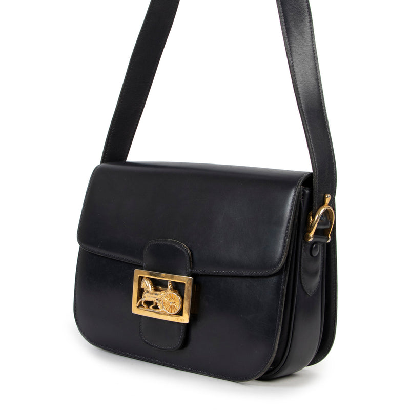 Are you looking for an authentic designer Celine Blue Vintage Box Bag? We buy and sell your authentic designer bags for the best price.
