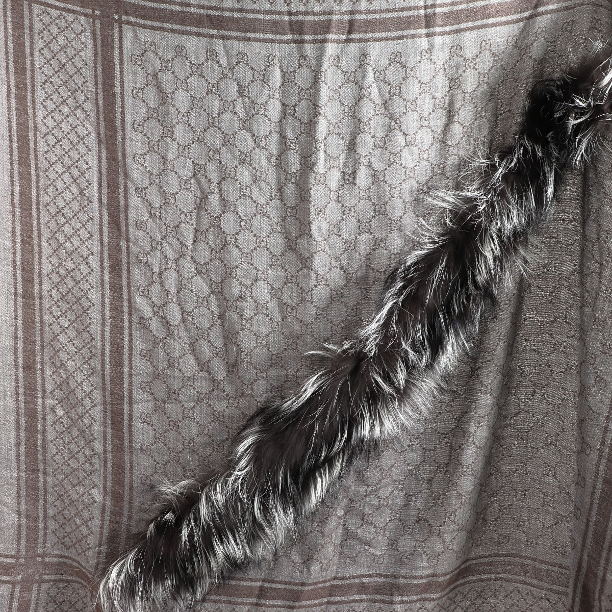 Buy an authentic second-hand Gucci Grey Monogram Wool Fur Scarf in very good condition at Labellov in Antwerp.