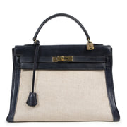 Hermès Kelly 32 Toile Blue Marine for the best price at Labellov secondhand luxury