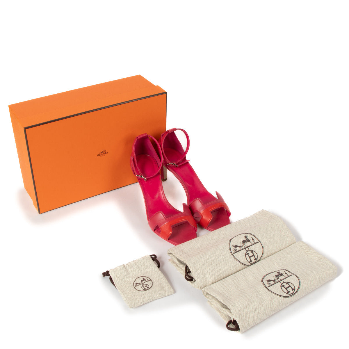 Crafted from premium leather in a striking pink and red color palette, these sandals exude sophistication and vibrancy. The adjustable ankle strap ensures a secure and comfortable fit, while the sleek design and signature Hermès craftsmanship make them a