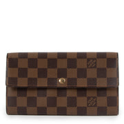 Buy online authentic second hand Louis Vuitton 2004 Vintage Damier Ebene Sarah Long Wallet in very good condition at Labellov in Antwerp