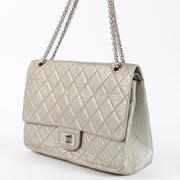 Authentic pre-loved Chanel Silver Maxi 2.55 Bag on Labellov.com