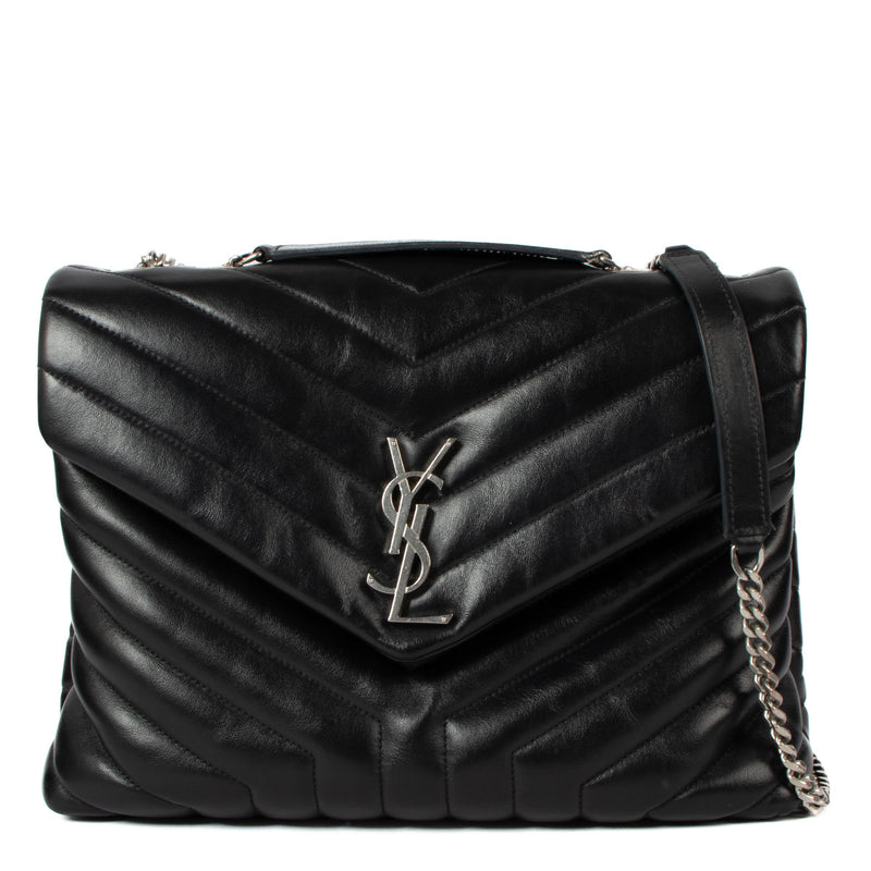 The Saint Laurent Black Medium Loulou Bag is a sophisticated blend of style and practicality. Crafted from soft, quilted black leather, this iconic bag is elevated by sleek silver-toned hardware, making it a timeless addition to any wardrobe. Its medium s