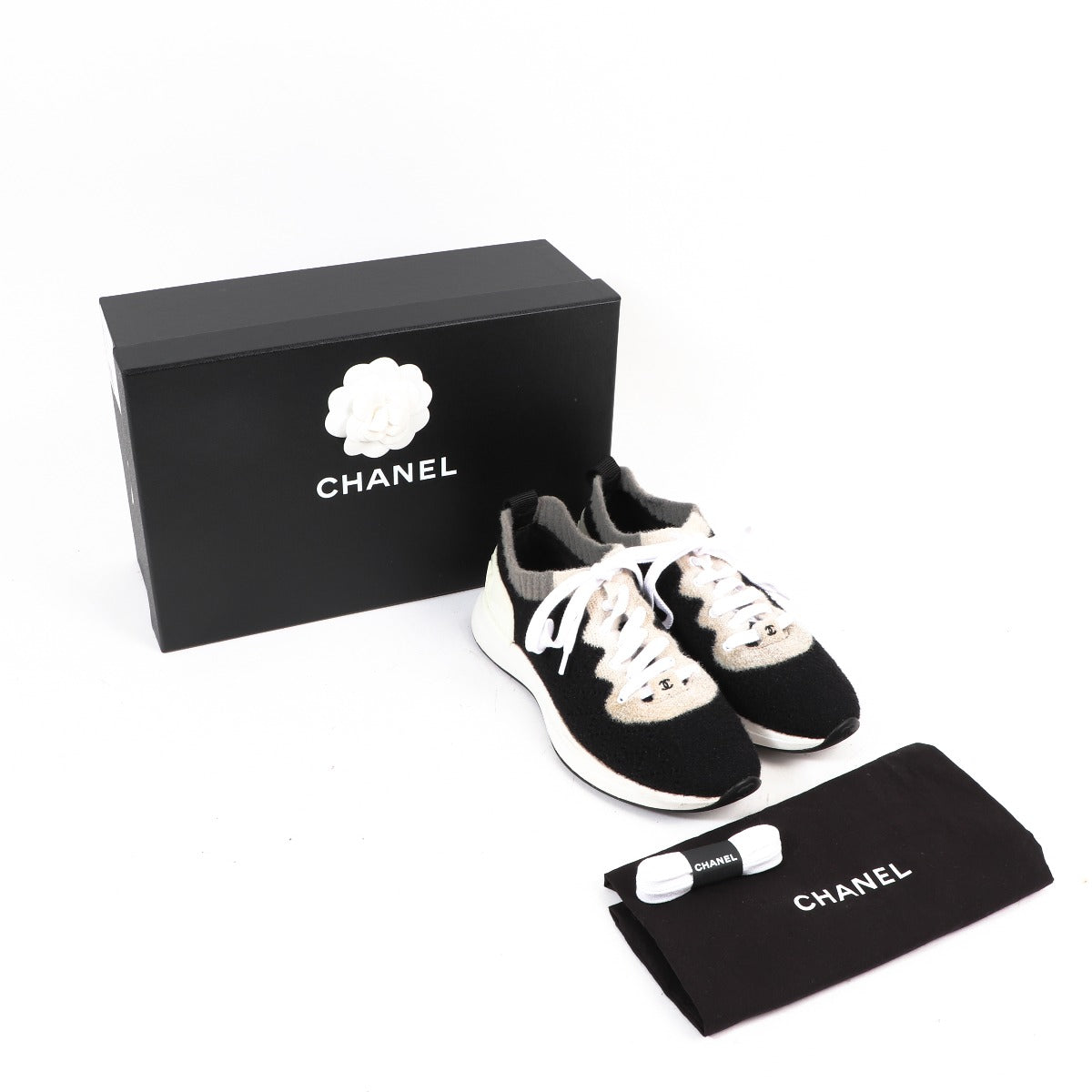 Buy an authentic second hand Chanel Black Sneakers in good condition at Labellov Antwerp.