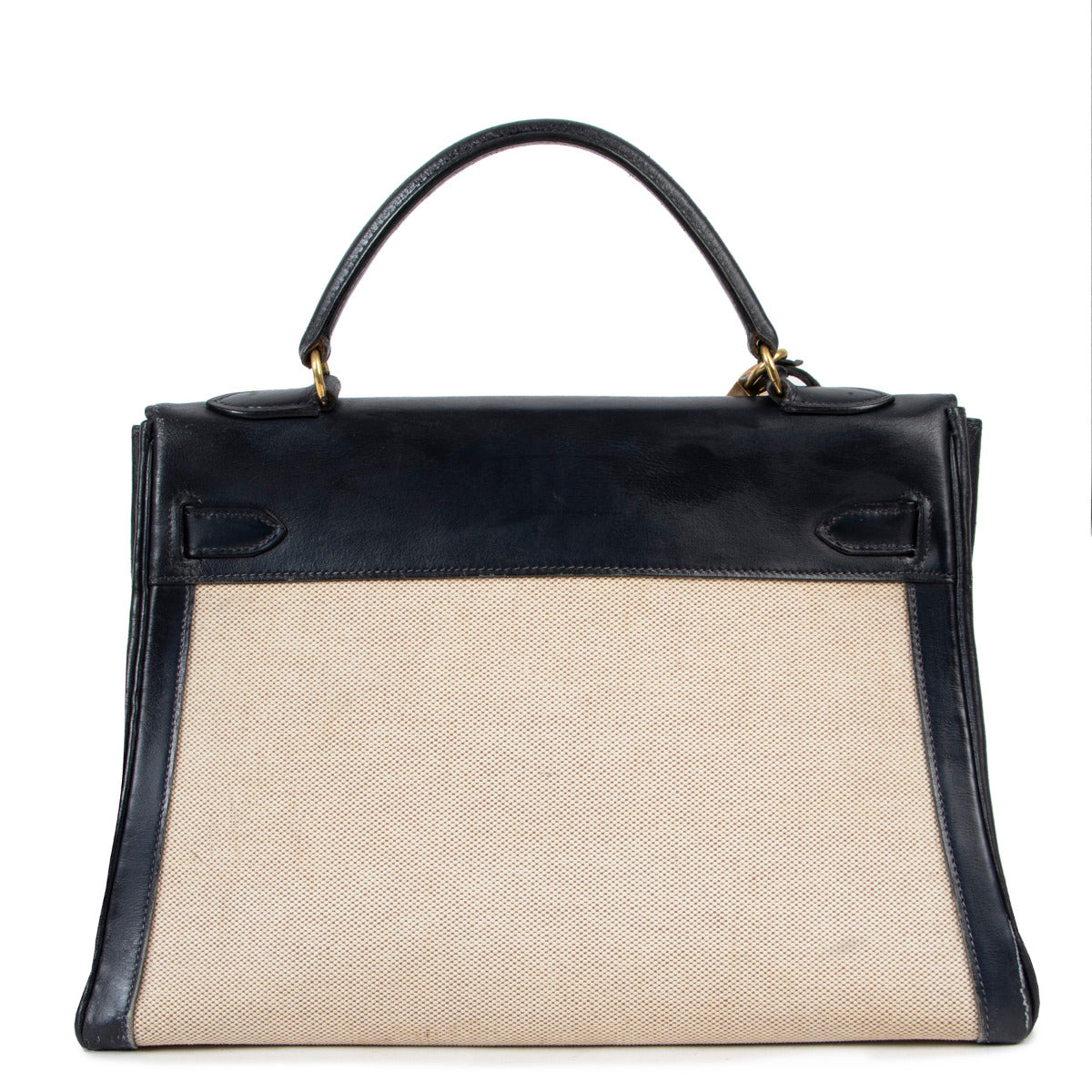Buy and sell preloved Hermès Kelly 32 blue box calf lather with natural toile insert and gold toned hardware at Labellov secondhand luxury.