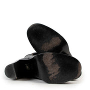 Black leather boots by Gucci on a safe site