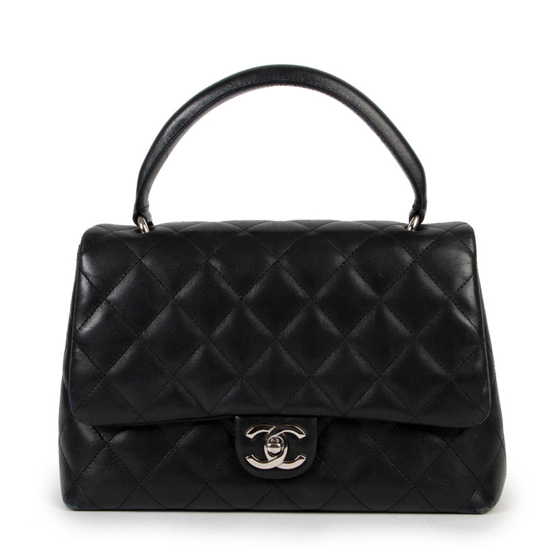 Chanel Black Medium Top Handle Coco bag in lambskin leather for the best price at Labellov secondhand luxury in Antwerp