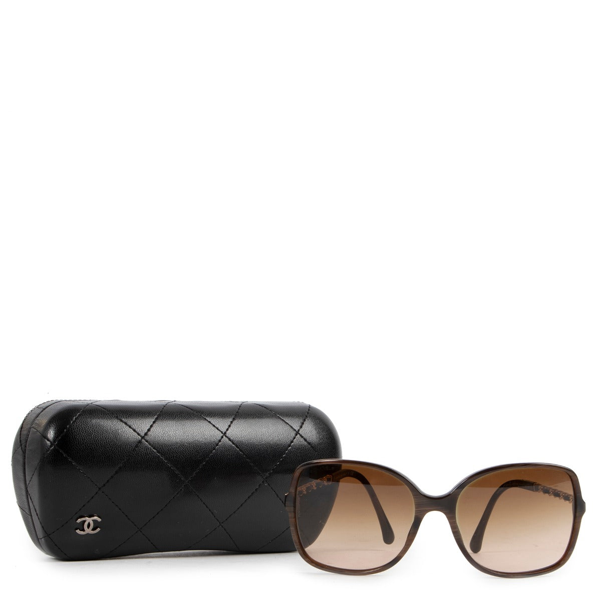 These Chanel Brown Sunglasses are available at Labellov in good condition online or in store